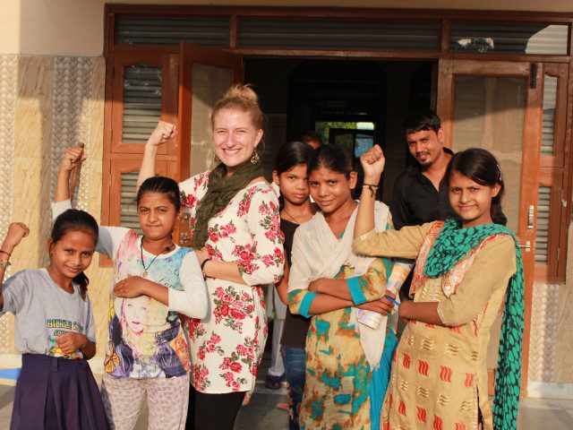ETASHA volunteer posing with beneficiaries